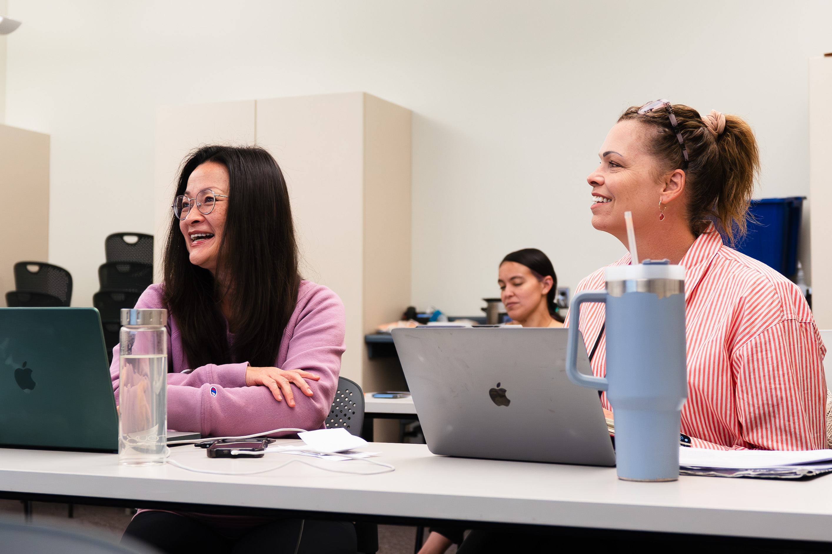 A group of people working on computers