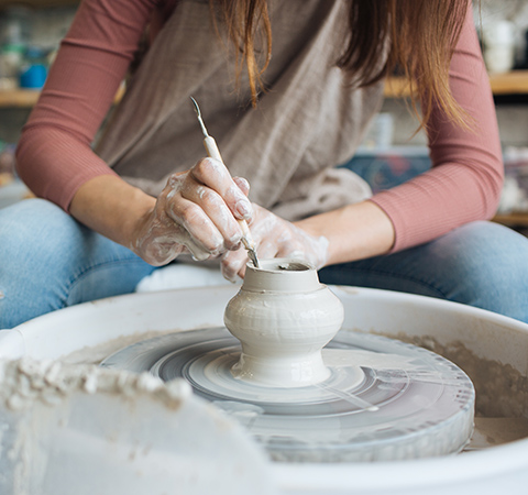 girl doing clay