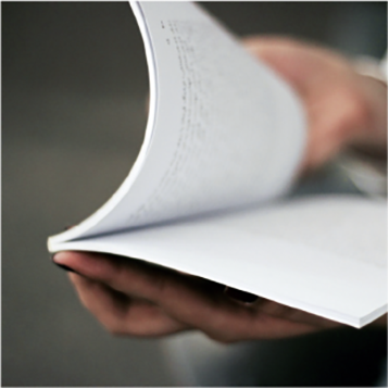 An open book being held