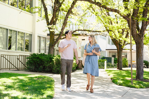 Man and woman talking on pathway