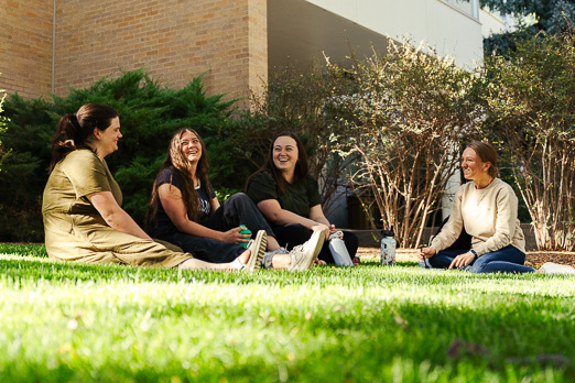 Group of women talking on grass