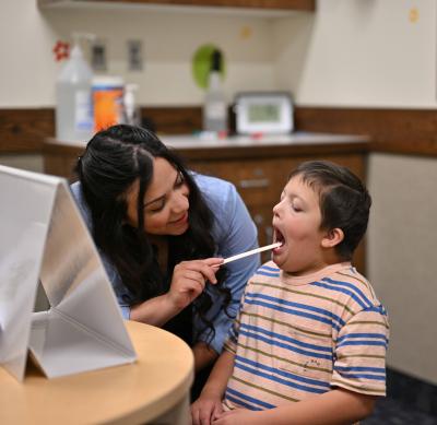 A doctor helping a child