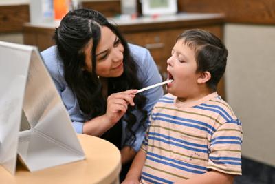 A doctor helping a child